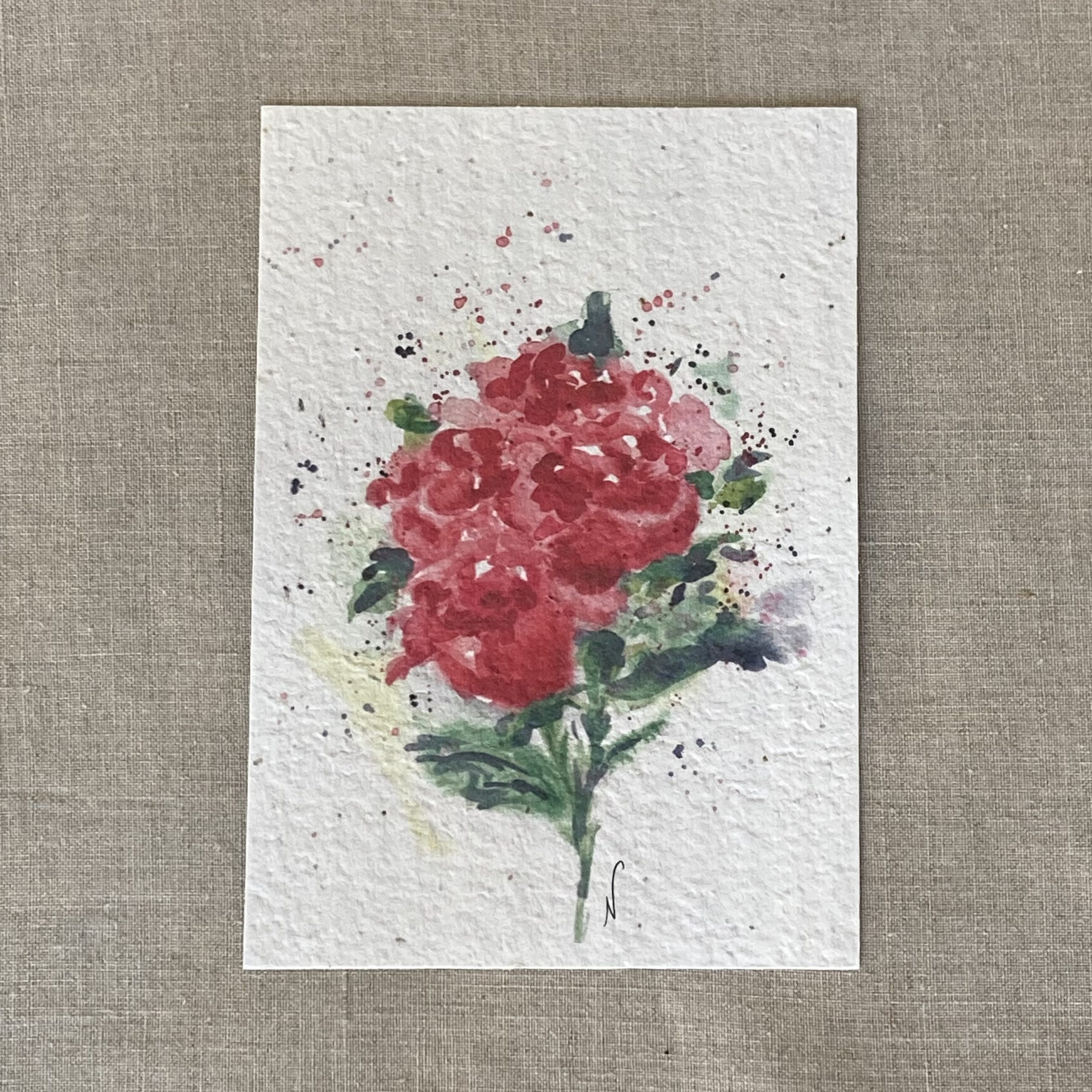 carte à plantée illustrée par un bouquet de roses floues a l'aquarelle